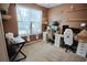 Well-lit home office with neutral walls, carpeted floor, two computer desks and ergonomically designed, adjustable office chairs at 9219 Chandler Dr, Groveland, FL 34736