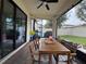 Covered patio with brick pavers, ceiling fan, and backyard views at 9219 Chandler Dr, Groveland, FL 34736