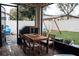 Covered patio with brick pavers, outdoor furniture, and backyard views at 9219 Chandler Dr, Groveland, FL 34736