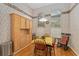 Bright breakfast nook with wood floors, floral wallpaper, and built in cabinets at 9588 Se 124Th Loop, Summerfield, FL 34491