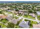 Located in a quiet neighborhood, the home boasts a well-maintained lawn and beautiful landscaping at 965 Dartmouth Ave, Clermont, FL 34711