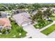 A well-maintained home has a two-car garage and a beautifully landscaped front yard at 965 Dartmouth Ave, Clermont, FL 34711