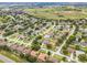 This property sits in a well-established neighborhood, showcasing neatly lined streets and lush greenery at 965 Dartmouth Ave, Clermont, FL 34711