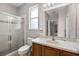 Neutral bathroom featuring tile shower with glass door and wood vanity at 965 Dartmouth Ave, Clermont, FL 34711