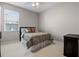 Cozy bedroom features a ceiling fan and a window with natural light at 965 Dartmouth Ave, Clermont, FL 34711
