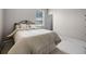 Carpeted bedroom with a window featuring neutral paint color and baseboard trim at 965 Dartmouth Ave, Clermont, FL 34711