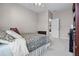 This bedroom boasts a ceiling fan and neutral paint color with an open door at 965 Dartmouth Ave, Clermont, FL 34711