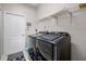 The laundry room is equipped with modern, front-load washer and dryer at 965 Dartmouth Ave, Clermont, FL 34711