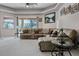 Spacious living room featuring a comfortable sofa, ceiling fan, and view of the outdoors at 965 Dartmouth Ave, Clermont, FL 34711