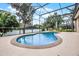 Enjoy a large, in-ground pool with a screened-in enclosure at 965 Dartmouth Ave, Clermont, FL 34711