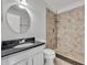 Bathroom featuring granite countertop, decorative tile accent, a modern vanity, and walk-in shower at 102 Lake Emma Cove Dr # 102, Lake Mary, FL 32746