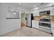 Updated kitchen features stainless steel appliances, granite countertops, and ample white cabinets at 102 Lake Emma Cove Dr # 102, Lake Mary, FL 32746