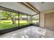 Screened porch with tiled floor, offering a relaxing outdoor space with view of the backyard at 102 Lake Emma Cove Dr # 102, Lake Mary, FL 32746