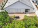An aerial view showcasing the backyard brick patio and white fence at 1034 Copenhagen Way, Winter Garden, FL 34787