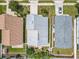 Aerial view of home showing roof, backyard with patio and landscaping, and proximity to neighborhood street at 1034 Copenhagen Way, Winter Garden, FL 34787
