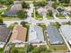 Aerial view showing home in neighborhood with fenced backyard and patio, close to street and other homes at 1034 Copenhagen Way, Winter Garden, FL 34787
