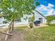 Cozy backyard with a brick patio, mature trees, and a grill; great for relaxing at 1034 Copenhagen Way, Winter Garden, FL 34787