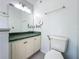 Bathroom with a vanity with ample storage and a toilet with bidet attachment at 1034 Copenhagen Way, Winter Garden, FL 34787