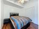 This bedroom offers lots of light, a ceiling fan, wood floors, and closet space at 1034 Copenhagen Way, Winter Garden, FL 34787