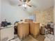 Bedroom with a ceiling fan and boxes and clutter at 1034 Copenhagen Way, Winter Garden, FL 34787