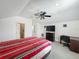 This is a bedroom that also features a desk, tv, and ceiling fan at 1034 Copenhagen Way, Winter Garden, FL 34787