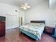 Bedroom with vaulted ceiling, wood floors, and double door closet at 1034 Copenhagen Way, Winter Garden, FL 34787