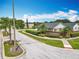 Entrance to Sterling Pointe community with street, landscaping, and view of homes in neighborhood at 1034 Copenhagen Way, Winter Garden, FL 34787