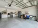Attached two car garage with laundry hookups, storage and painted floor at 1034 Copenhagen Way, Winter Garden, FL 34787