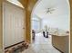 The home opens to a living room with tile flooring, a fan, a front-facing window, and comfortable seating at 1034 Copenhagen Way, Winter Garden, FL 34787
