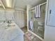 Bathroom featuring a walk-in shower, neutral colors, and ample storage space at 105 Avocado Cv, Leesburg, FL 34748