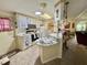 Charming kitchen featuring white cabinets, and a breakfast bar at 105 Avocado Cv, Leesburg, FL 34748