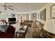 Inviting living room with a comfortable sectional sofa and a large flat-screen television for entertainment at 105 Avocado Cv, Leesburg, FL 34748