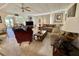 Inviting living room features comfortable furniture, ceiling fan, and view at 105 Avocado Cv, Leesburg, FL 34748