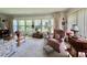 Bright sunroom with large windows, comfortable seating, and a relaxing atmosphere at 105 Avocado Cv, Leesburg, FL 34748