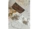 Close-up of a damaged ceiling with exposed wood and peeling paint showcasing necessary repairs at 110 S Trowell Ave, Umatilla, FL 32784