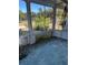 Enclosed porch with pane windows and view of greenery in front at 110 S Trowell Ave, Umatilla, FL 32784