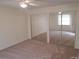 Bedroom with ceiling fan and a mirrored closet at 1108 Apple Ter, Leesburg, FL 34748