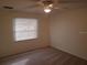 Bedroom featuring a ceiling fan and natural light from a window at 1108 Apple Ter, Leesburg, FL 34748