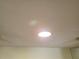 Close-up of a ceiling with a recessed light, providing bright and even illumination at 1108 Apple Ter, Leesburg, FL 34748