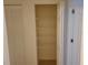 Open closet features ample shelving, providing efficient storage and organization solutions in a well-lit space at 1108 Apple Ter, Leesburg, FL 34748
