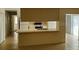 Open-concept kitchen featuring a breakfast bar and easy access to living areas at 1108 Apple Ter, Leesburg, FL 34748