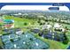 Aerial view of community amenities including tennis courts, shuffleboard, and fitness center at 1180 Mesa Verde Ct, Clermont, FL 34711
