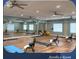 Well-equipped aerobics room with mirrors, mats, and chairs for fitness activities at 1180 Mesa Verde Ct, Clermont, FL 34711