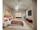 Comfortable bedroom featuring a plush bed, stylish decor, and ample natural light at 1180 Mesa Verde Ct, Clermont, FL 34711