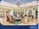 Clubhouse interior showcasing comfortable seating, a fireplace, and elegant decor at 1180 Mesa Verde Ct, Clermont, FL 34711
