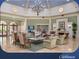 Elegant clubhouse lounge area with comfortable seating and a cozy fireplace at 1180 Mesa Verde Ct, Clermont, FL 34711