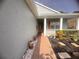 Charming home featuring a welcoming walkway leading to the front door and well-maintained landscaping at 1180 Mesa Verde Ct, Clermont, FL 34711