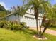 Well-maintained home with mature landscaping, a spacious garage, and a manicured lawn at 1180 Mesa Verde Ct, Clermont, FL 34711
