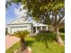 Charming single-story home featuring lush landscaping, a well-manicured lawn, and inviting curb appeal at 1180 Mesa Verde Ct, Clermont, FL 34711