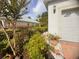 Lush front yard landscaping featuring vibrant greenery, a brick-lined pathway, and well-maintained shrubbery at 1180 Mesa Verde Ct, Clermont, FL 34711